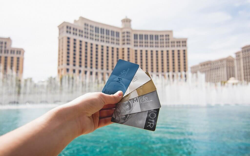 M life Rewards cards in front of the Fountains of Bellagio